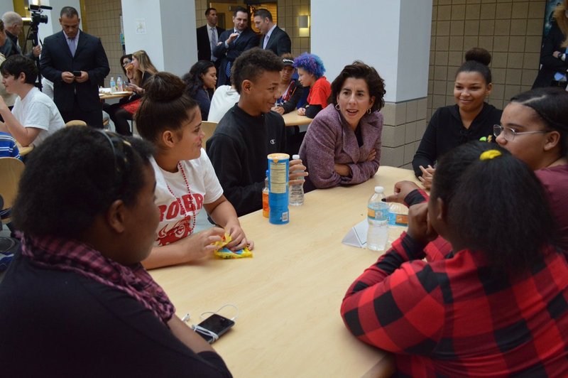 Gina at the table with students